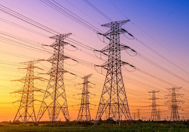 Group of electricity transmission towers and lines