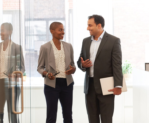 Man and woman talking in an office