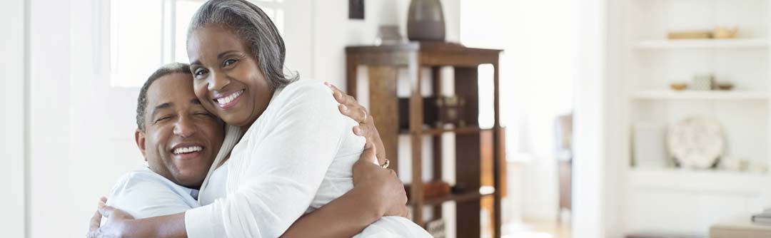 man and woman hugging