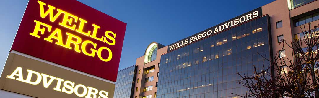 Outside view of Wells Fargo Advisors; Wells Fargo Advisors sign and part of building
