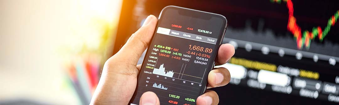 A person looking at stock market performance on their phone