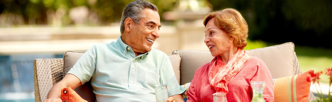 Couple sitting on a couch outside