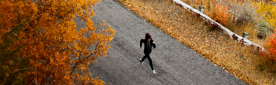 A woman jogging on a road