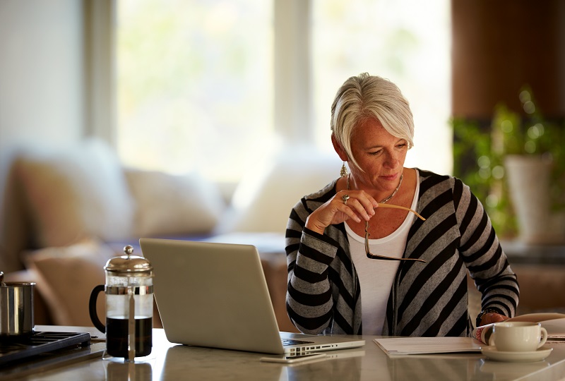 Woman at desk with laptop