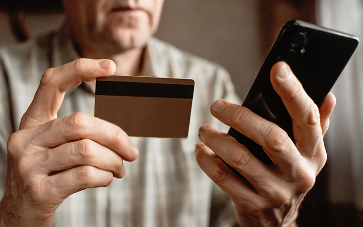 Man double-checking credit card