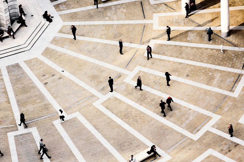 overhead view of large courtyard with people walking randomly
