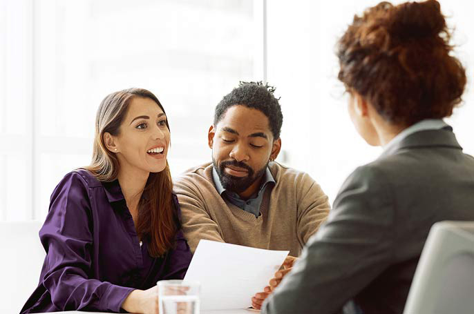 Couple meeting with their advisor