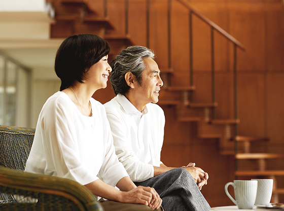 Senior couple seated in living room