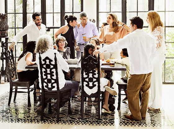 Multigenerational family gathered around dining table.