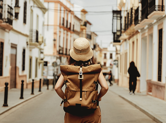 Rear view of female backpacker.
