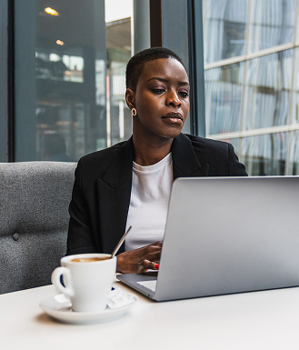 Person using laptop to looking for cash management services