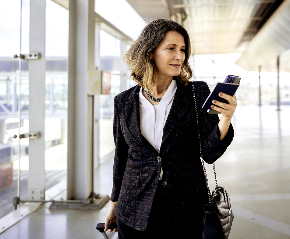 woman looking at her phone screen