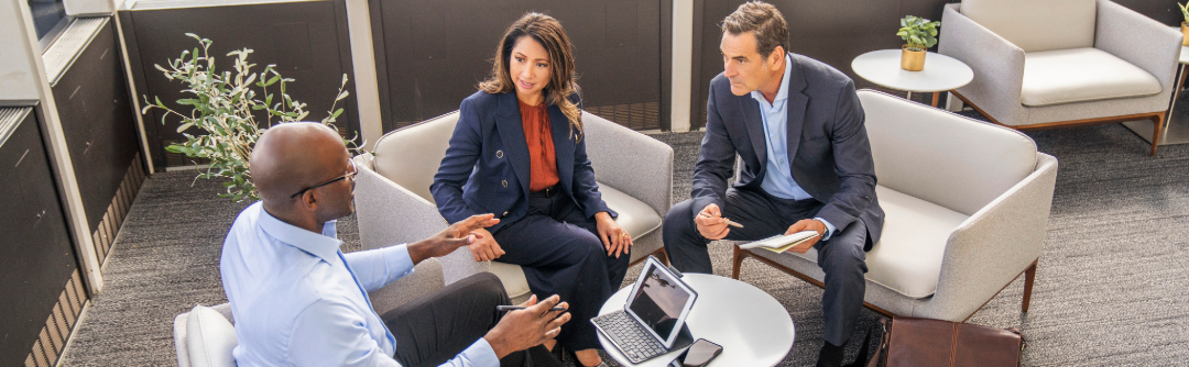 Man and woman speaking with financial advisor