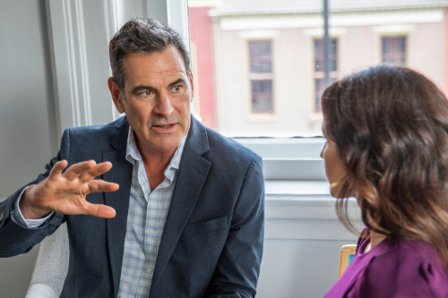 male and female looking at one another talking