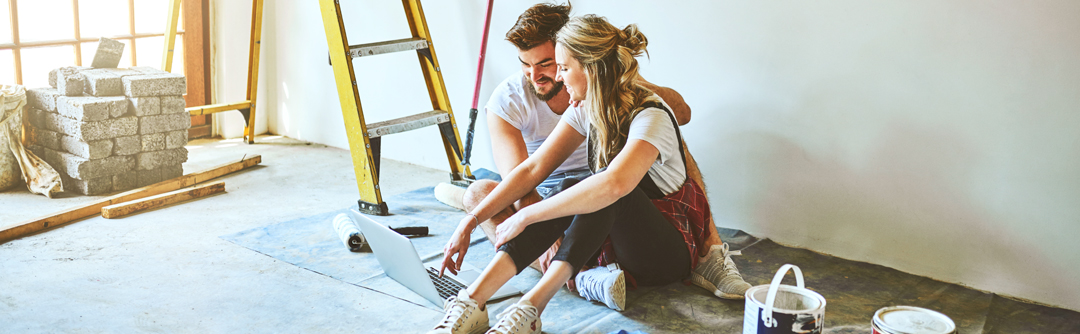 Woman and man painting room
